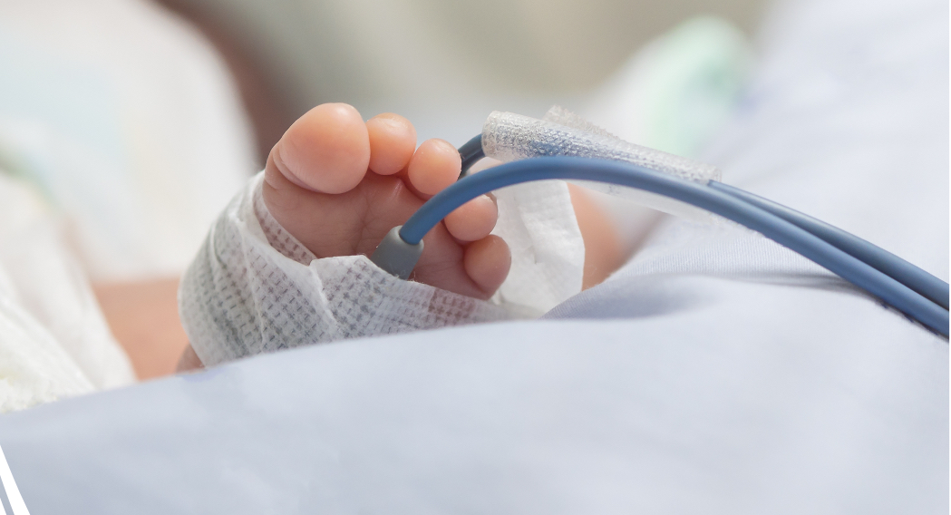 Infant's foot attached to monitor in NICU