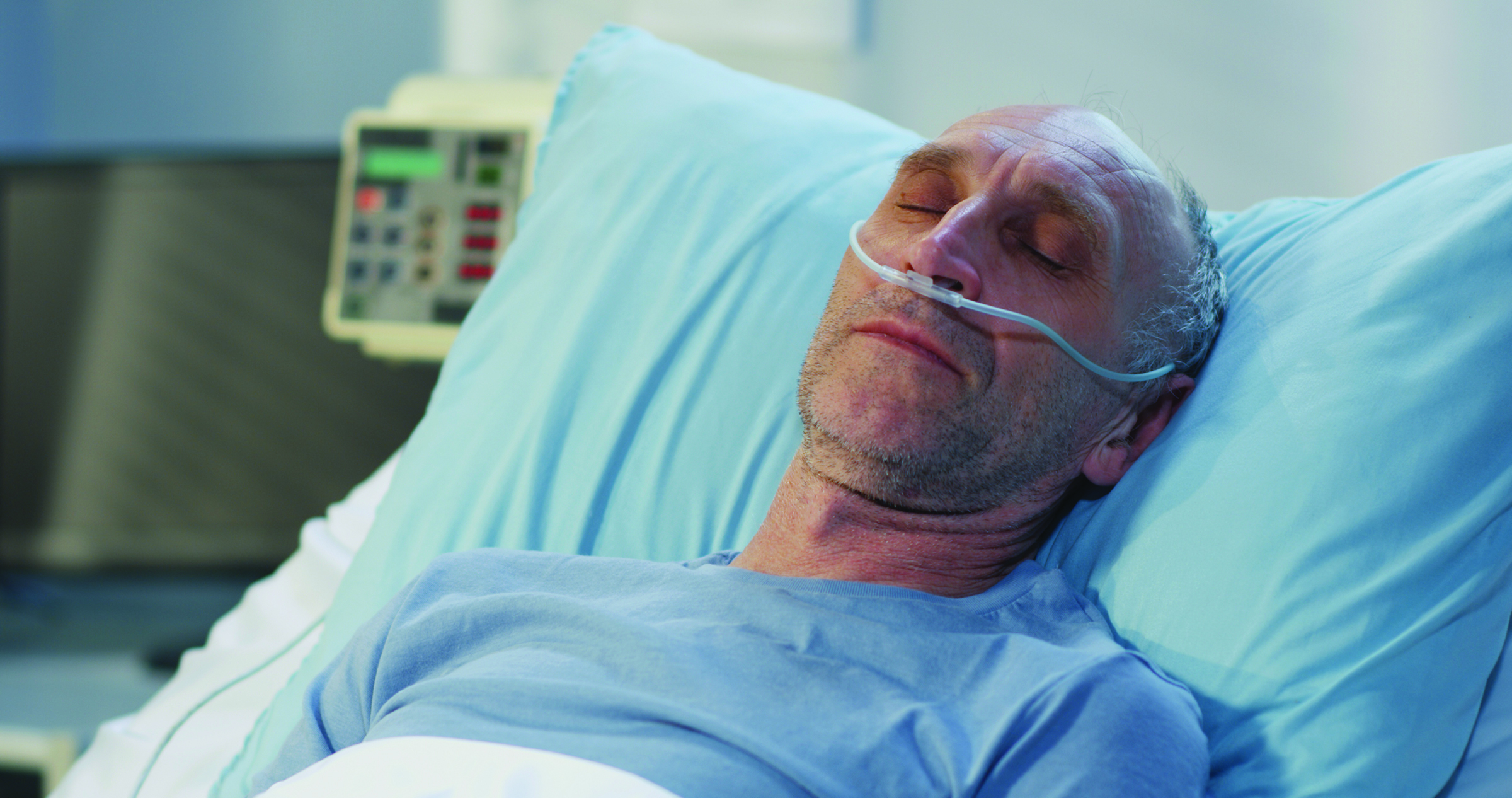 Medium,Close,Up,Shot,Of,Man,Lying,In,Hospital,Bed