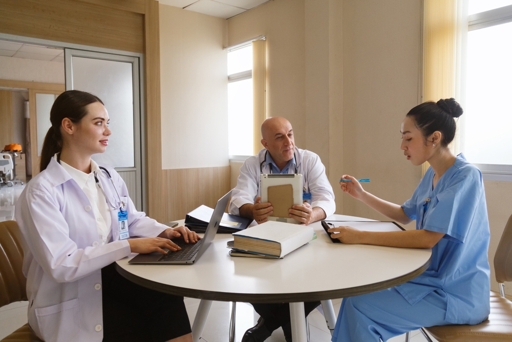 group of nurses working on a collaborative writing project