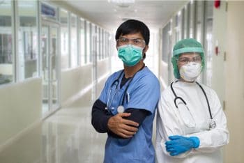 two healthcare workers in masks