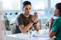 A nurse talking with a veteran