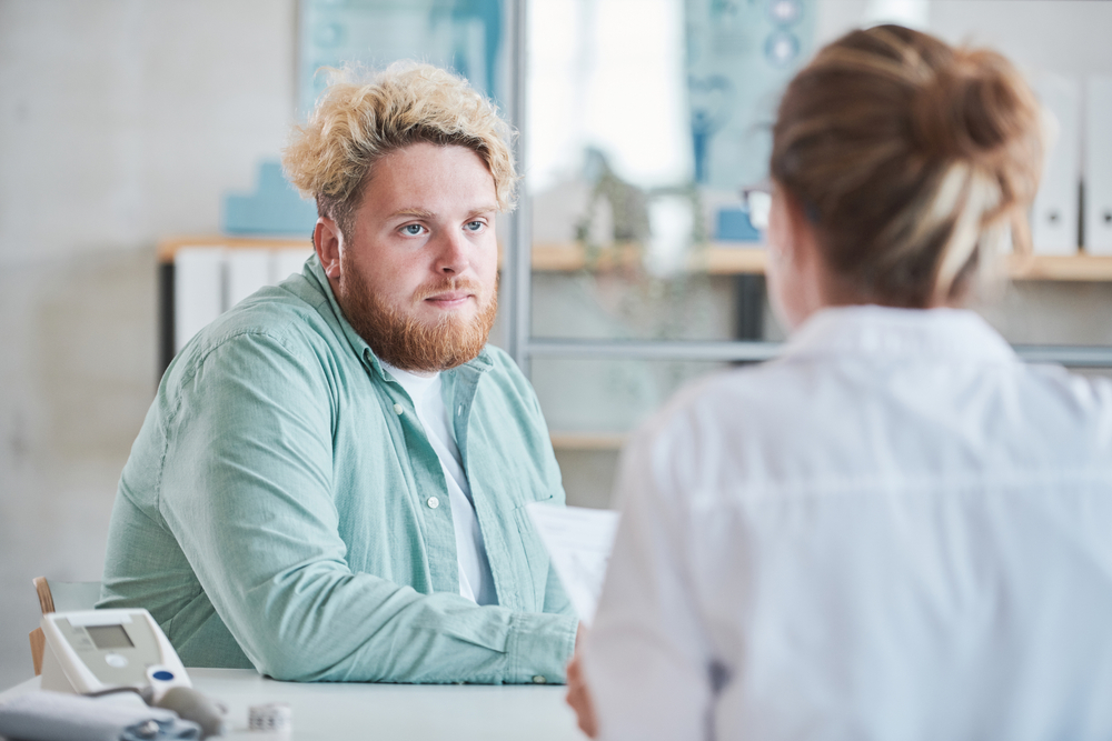 nurse talking to patient about obesity management