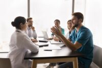 nurse leading meeting