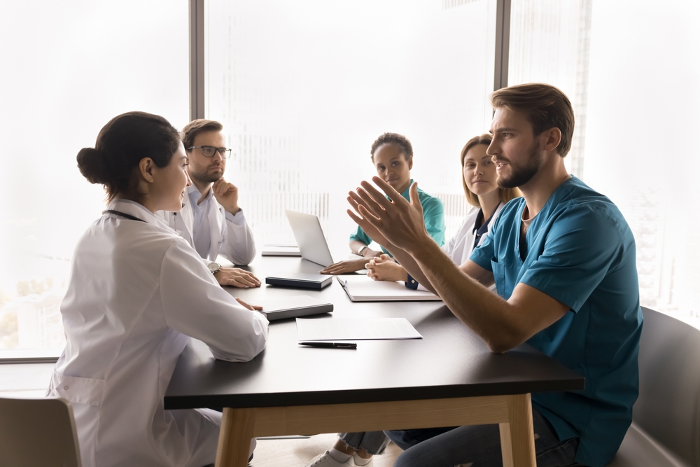 nurse leading meeting