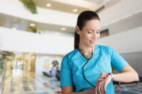 Nurse checking her watch