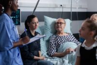 Nurse with family member in hospital