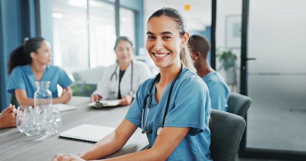 Young nurse at meeting
