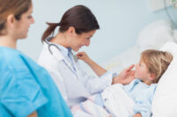 Nurse offering ancillary support to child