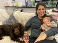 Lisa Bonfield cradles her newborn daughter, Adele, at home in New Orleans on Dec. 12, a few days after their first home visit from a nurse with the Family Connects New Orleans program. ( Rosemary Westwood/WWNO )